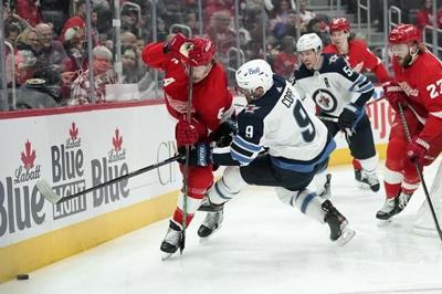 Connor Hellebuyck stops 33 shots, Jets beat Red Wings 3-0