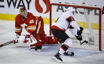 Murray collects first win of the season as Senators upset Flames 4-1