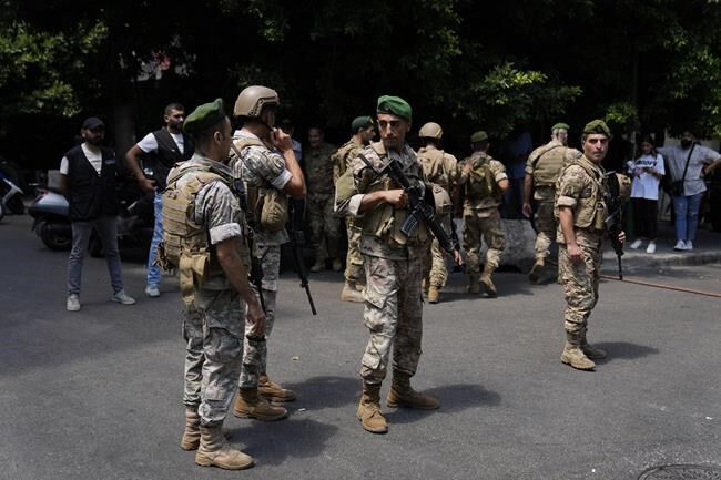 Armed man demanding savings takes Beirut bank staff hostage