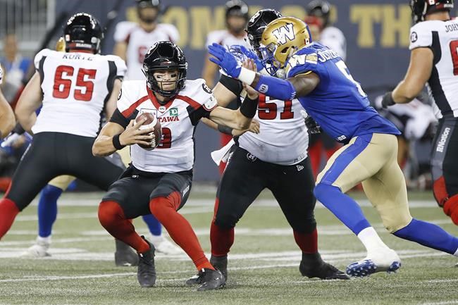 June 15, 2023: Ottawa Redblacks quarterback Nick Arbuckle (9) runs while  looking to pass during the CFL game between Calgary Stampeders and Ottawa  Redblacks held at TD Place Stadium in Ottawa, Canada.