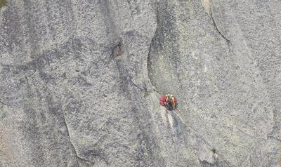 Two climbers, one of them injured, plucked off sheer mountain face in ѻý