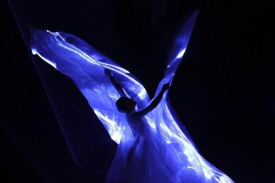 Iris Van Herpen unveils 'living' couture dress of bioluminescent algae in Paris