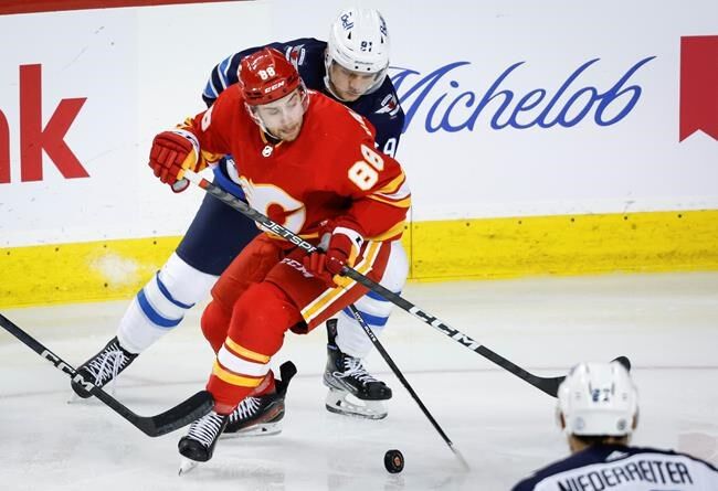 Winnipeg Jets preseason vs. Calgary Flames tonight, Connor Hellebuyck  starts in goal 