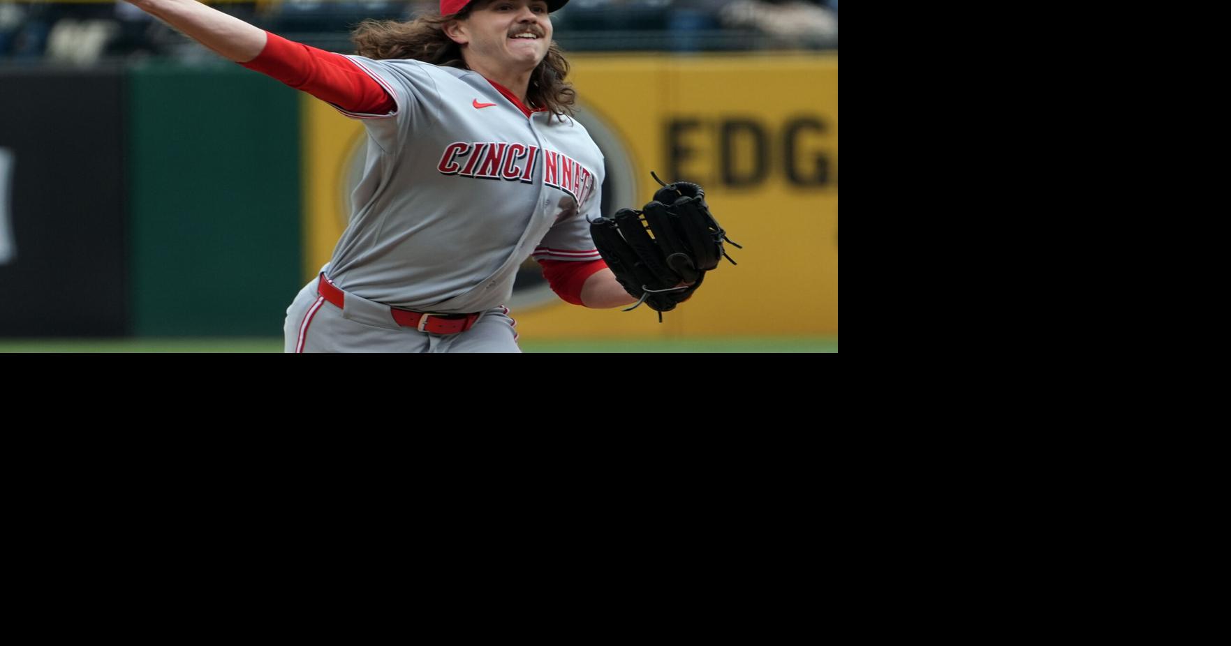 The Reds tie an MLB record by walking seven straight batters in a 17-7 loss to the Pirates