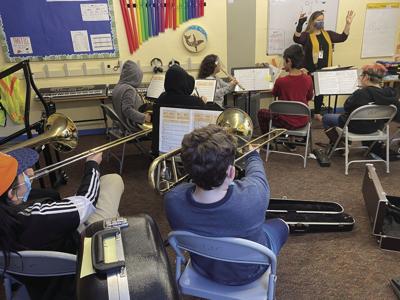 Tongass School of Arts and Sciences students practice playing instruments