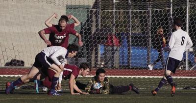 Ketchikan High School varsity soccer team defends against the Homer High School Mariners
