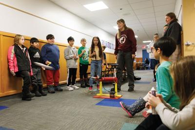 Addley Sanford launches her rocket down the hall at Houghtaling Elementary