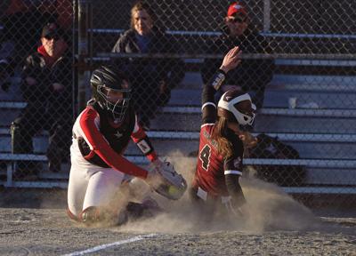 Paige Boehlert slides safe into home plate