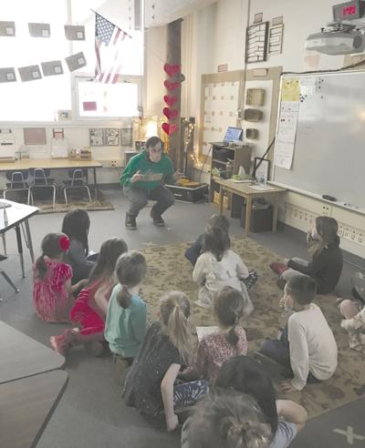Jack Finnegan works with Tongass School of Arts and Sciences students