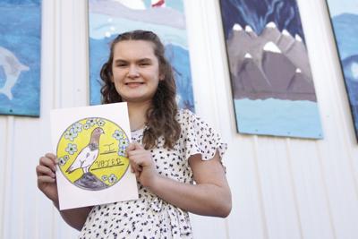 Keely Nall holds her "I Voted" design