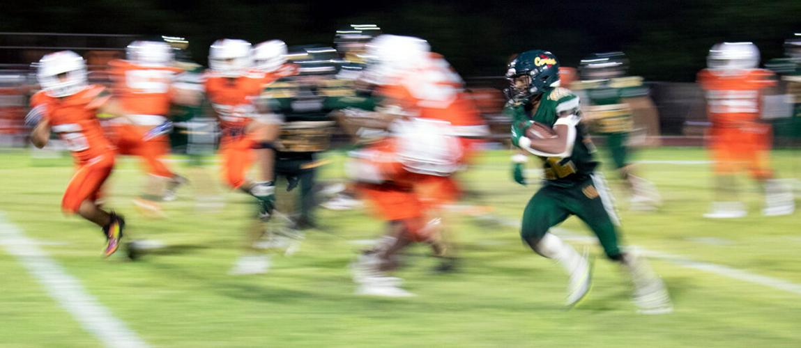 Despite missing quarterbacks, 'Canes score big in home finale Local