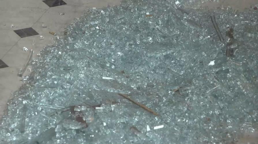 Man arrested after smashing several store front windows and punching ...