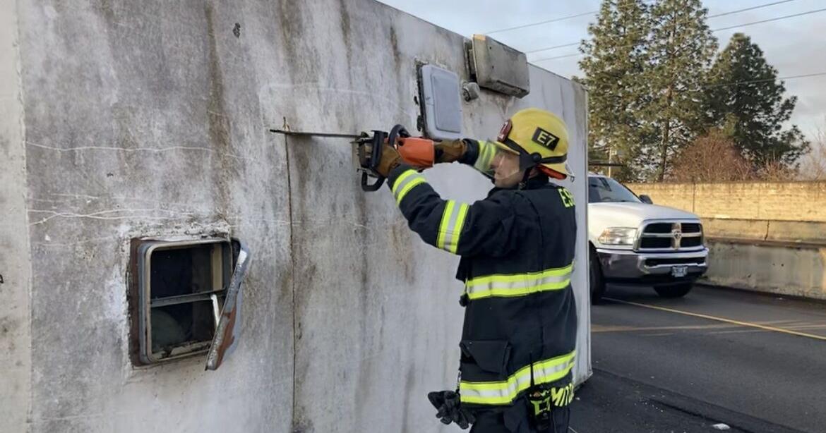 Firefighters cut open RV to rescue trapped occupant after rollover ...