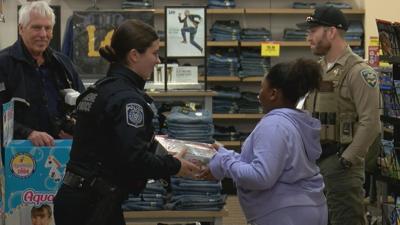 Dozens of Eugene children shop with a cop this holiday season.jpg