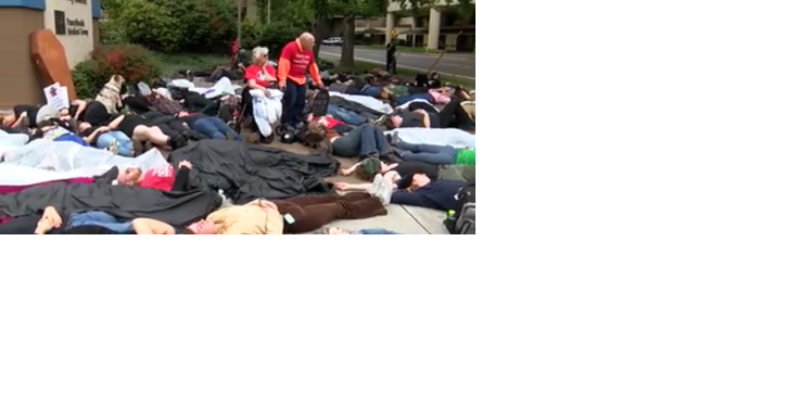 Demonstrators hold "die-in" to protest University District Hospital closure | News - Vimarsana News