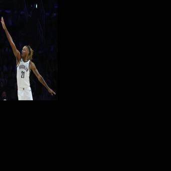 Luka Doncic of the Los Angeles Lakers shoots over Noah Clowney in the Lakers' NBA victory over the Brooklyn Nets