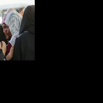 Palestinian mourn outside the Al-Shifa hospital, where casualties of Israeli strikes on Gaza City were brought