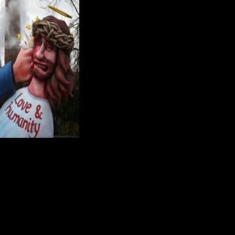 US President Donald Trump (L) features in a German carnival float as a heavy-handed ICE immigration agent