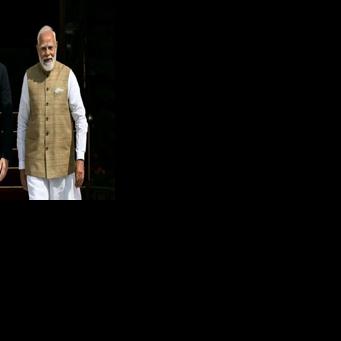 India's Prime Minister Narendra Modi (R) met with Canada's Prime Minister Mark Carney in New Delhi