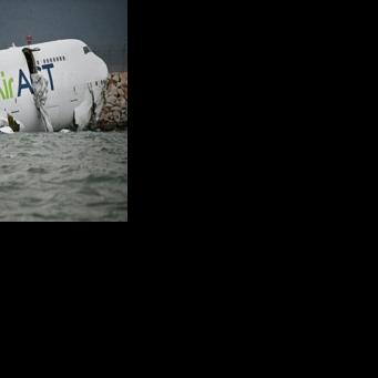 A cargo plane veered off the runway in Hong Kong, killing two people