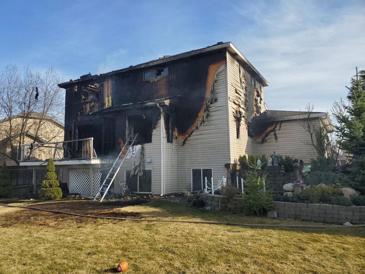 Firefighter sustains leg injury while battling Spokane Valley house