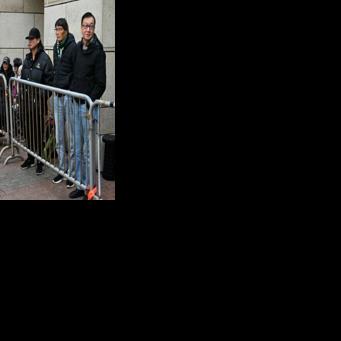 People queue outside a Hong Kong court for the sentencing arguments of convicted pro-democracy media tycoon Jimmy Lai