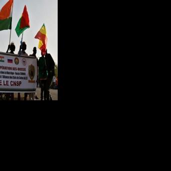 People in Niamey wave flags from Russia, Niger, Burkina Faso and Mali during a gathering to celebrate the withdrawal of the three African states from the Economic Community of West African States (ECOWAS) in January 2025