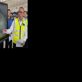 Steven Yiu, Airport Authority Hong Kong's executive director of operations, briefs reporters after a plan skidded off the tarmac