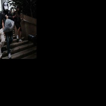 Kwok Yin-sang (L) was convicted of handling money belonging to his daughter, a wanted Hong Kong pro-democracy activist based overseas