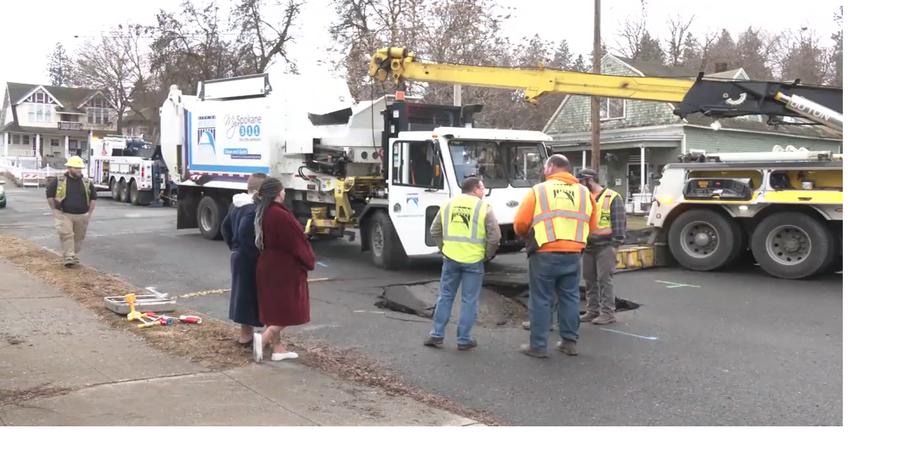 spokane-garbage-truck-falls-in-hole-caused-by-water-main-break