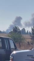 Structure fire visible near Spokane International Airport