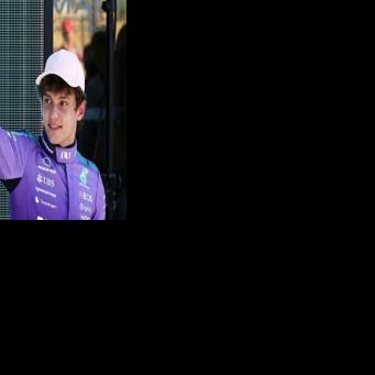 Mercedes' Italian teen driver Kimi Antonelli waves after winning the pole position during the qualifying session for the 2026 Miami Formula One Grand Prix