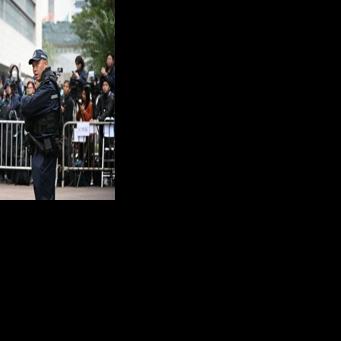 Police outside a court in Hong Kong for sentencing arguments of convicted pro-democracy media tycoon Jimmy Lai