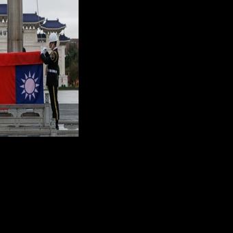 Taiwan's national flag is raised during an early morning ceremony in Taipei