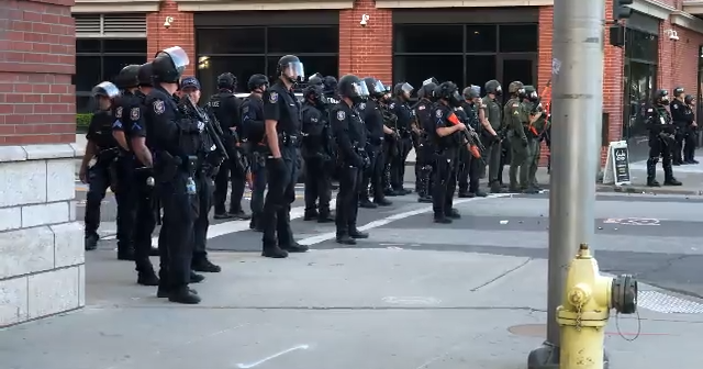 WATCH: Police line up in downtown Spokane to stop violent protesters ...