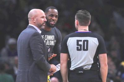 LeBron James of the Los Angeles Lakers talks with Jason Kidd