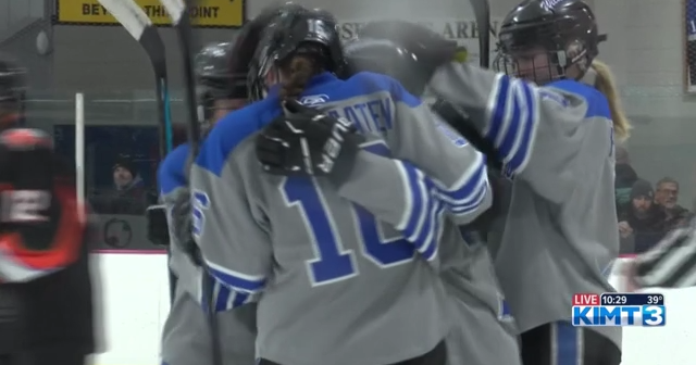 The Dodge County Wildcats girls #39 hockey team faces off against the