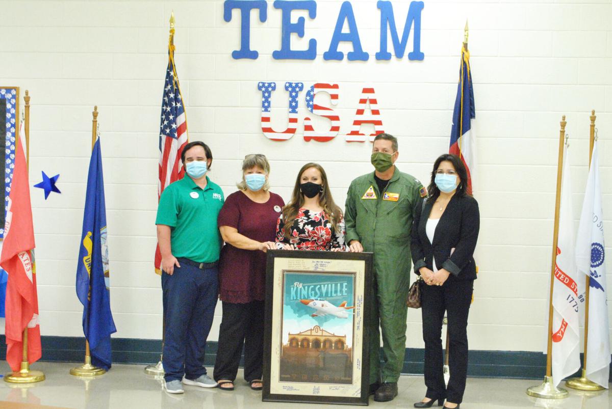 NAS-K presents signage to Perez Elementary