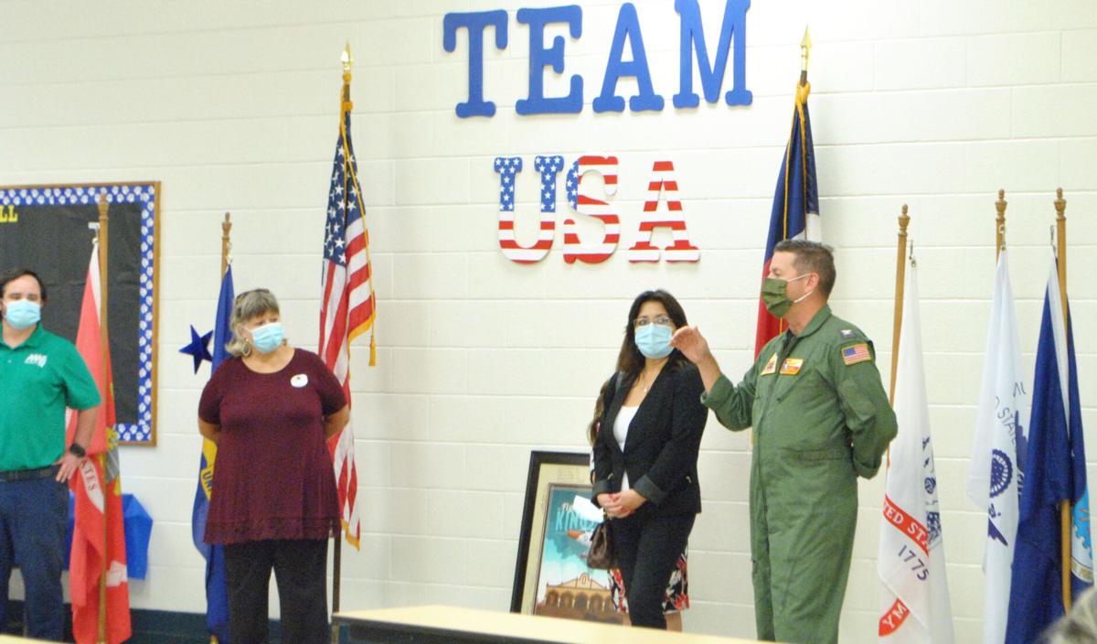 NAS-K presents signage to Perez Elementary