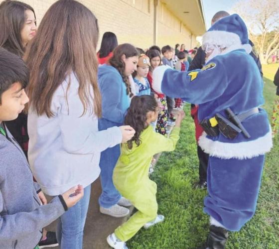 Blue Santa brings presents to students at Bishop CISD campuses