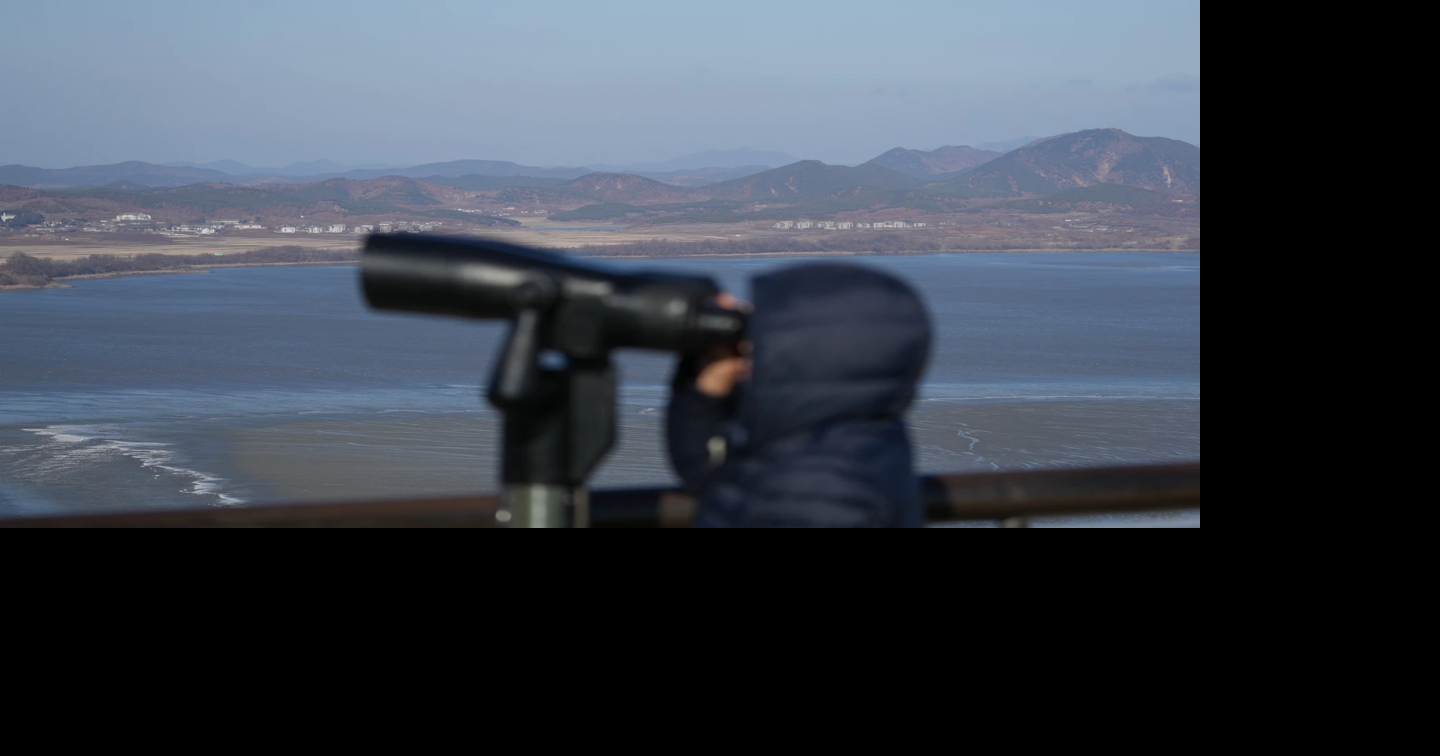 A visitor watches North Korean side from the unification observatory