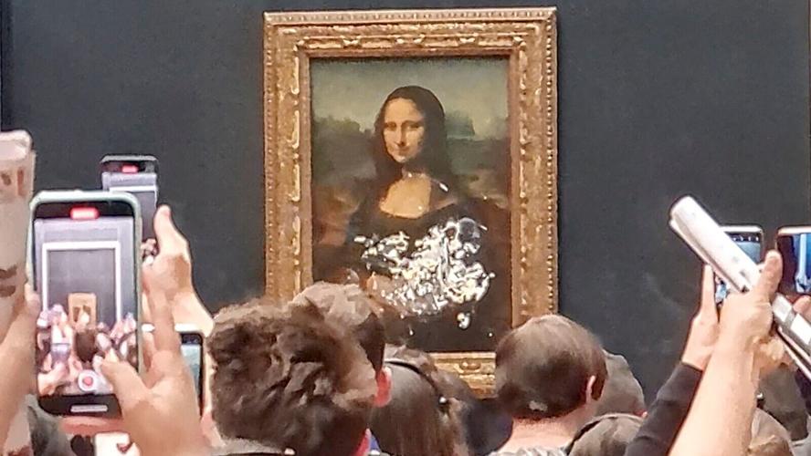 The 'Mona Lisa' has been caked in attempted vandalism stunt