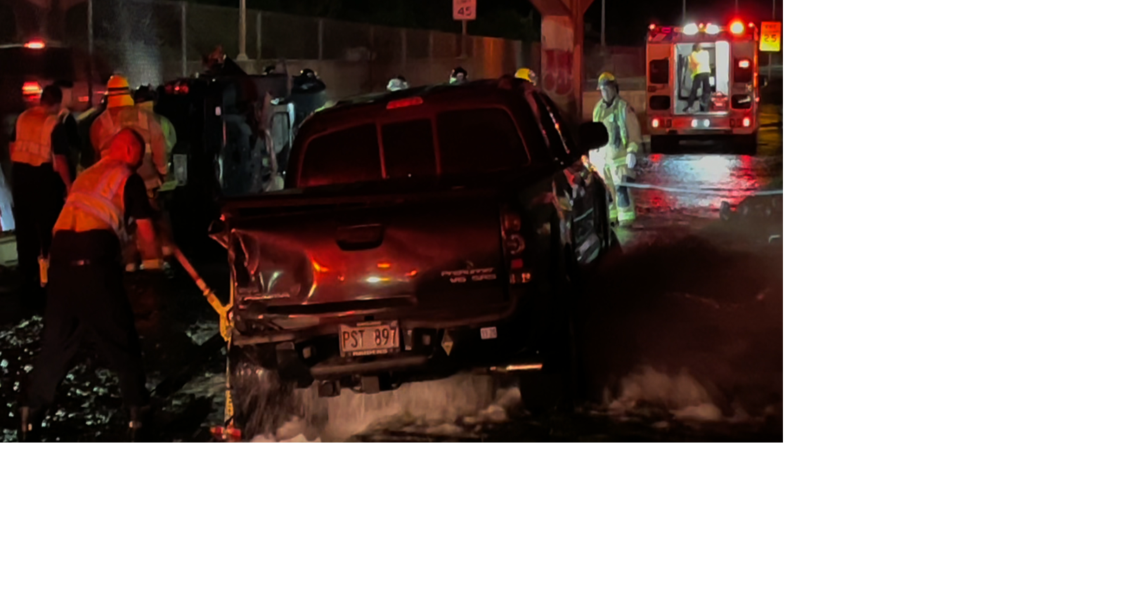 Truck lands on hydrant after McCully collision, four rescued