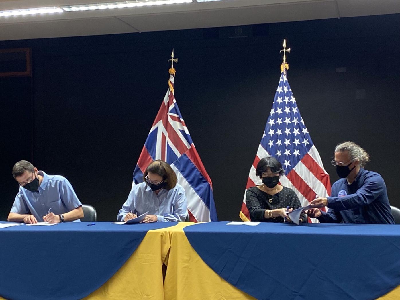 Representatives from the Hawai'i Department of Health, U.S. Navy, U.S. Army, and U.S. Environmental Protection Agency sign off on 'Drinking Water Sampling Plan.'