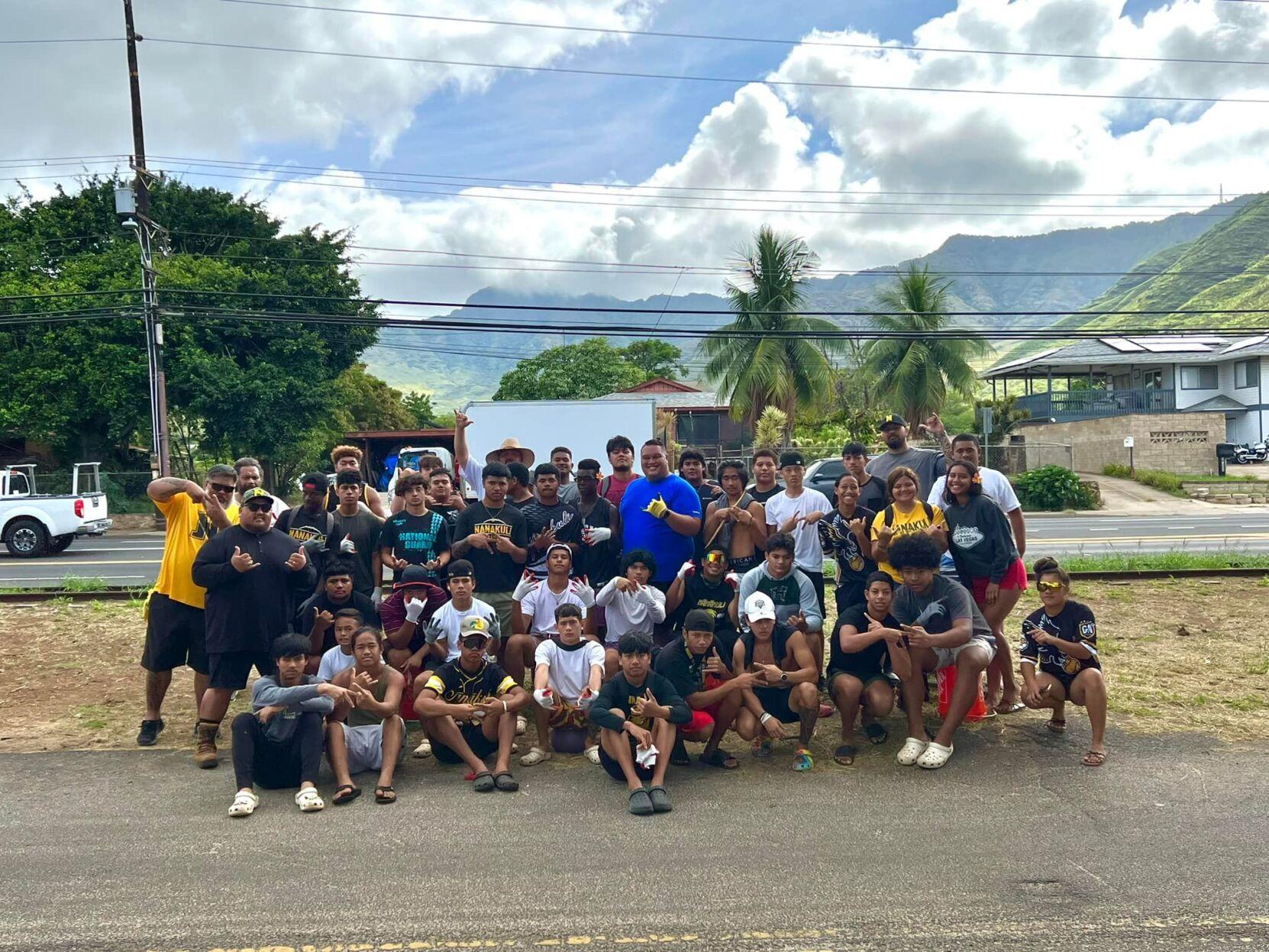 Nanakuli football players, community members team up to tackle trash in