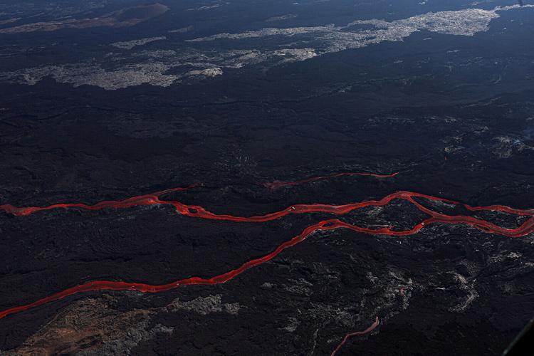 Hawaii activates National Guard as Mauna Loa's unpredictable lava flow creeps within 2 miles of critical highway
