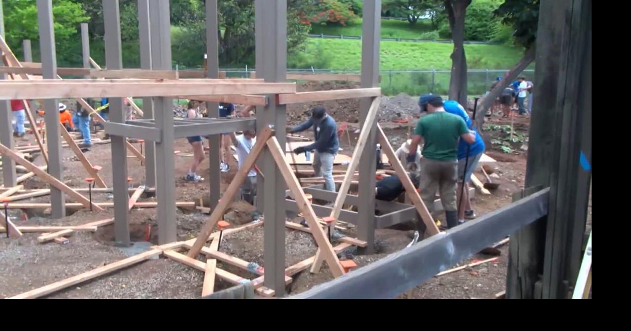 Assets School students help build new playground for K-8 students