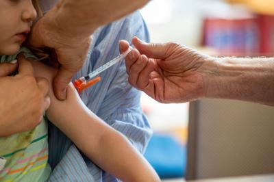 Covid-19 vaccines will be on the 2023 vaccine schedule, but that doesn't mean they're required in schools