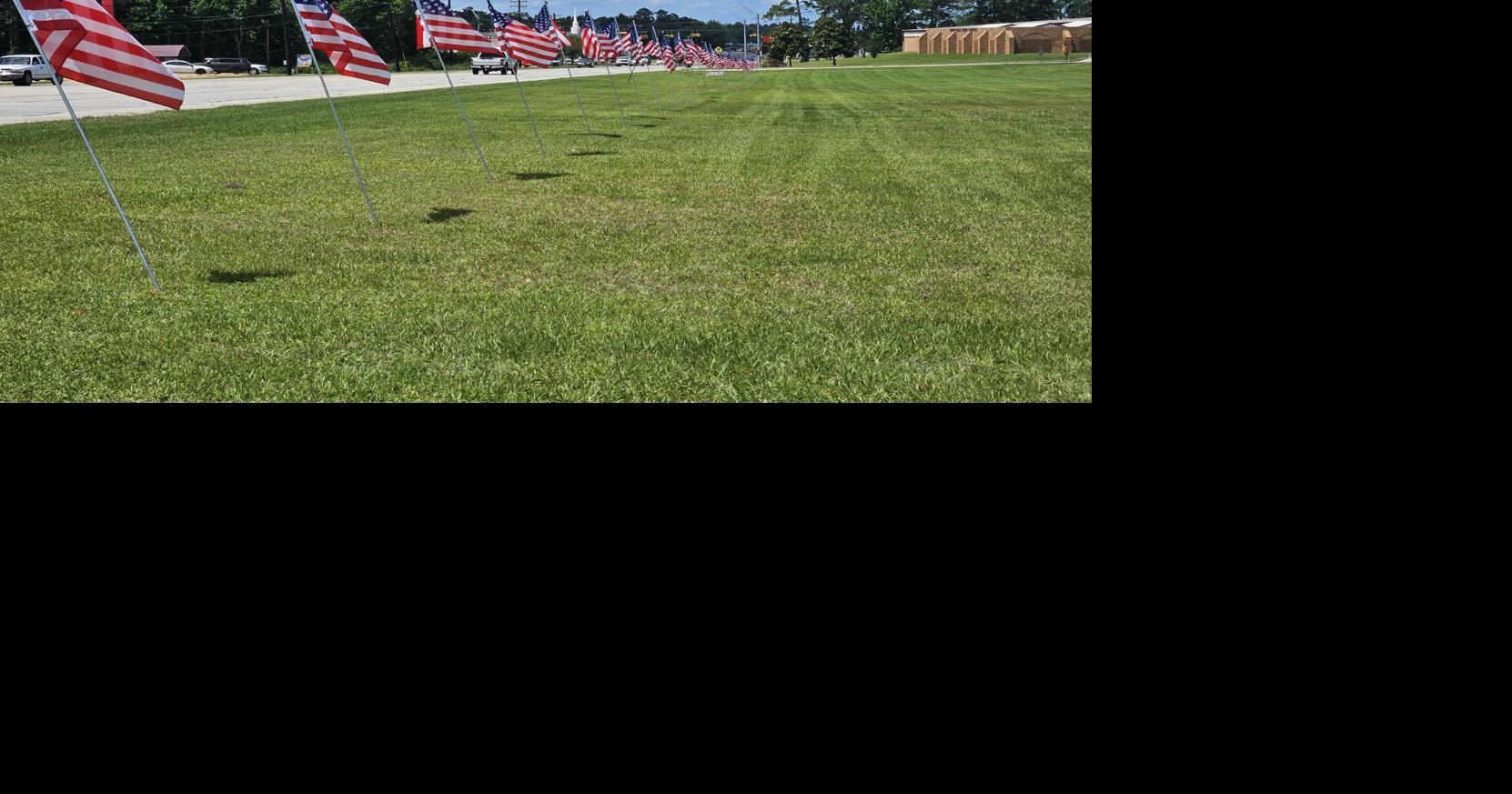 Heritage Society Lines Highway 96 with American Flags