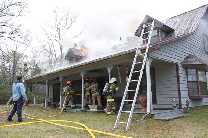 Home badly damaged in a late Monday morning blaze, firefighter injured ...